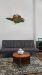 a living room with a couch and a coffee table at Zapotitlán Lofts in Retalhuleu