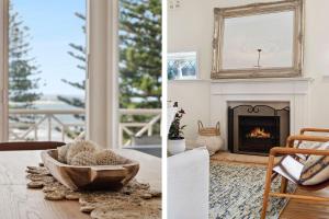 a living room with a fireplace and a mirror at Kaya in Collaroy