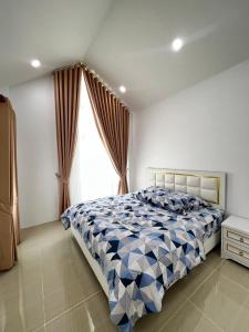 Giường trong phòng chung tại M&M garden house