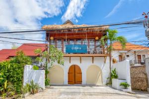 a house with a red roof at Villa Cabala Bali in Canggu