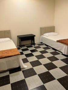 Voodi või voodid majutusasutuse Tagalradia Hostel toas