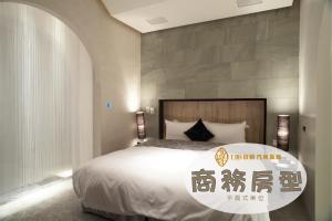 Ένα ή περισσότερα κρεβάτια σε δωμάτιο στο I DO Motel