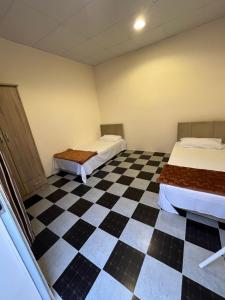 Voodi või voodid majutusasutuse Tagalradia Hostel toas