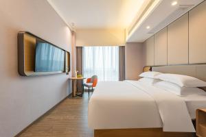 Televisyen dan/atau pusat hiburan di Poltton International Apartment - Guangzhou Knowledge City Wangcun Subway Station