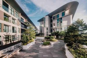 a courtyard of a building with trees and plants at Jk DeLOFTS 03 6Pax 150Mbps 2BedR 2BathR 1Carpark in Kuching