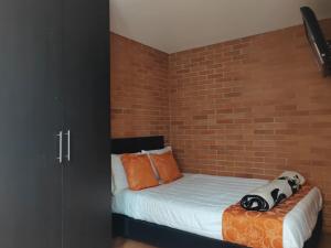 Letto o letti in una camera di Hotel Bogota Astral