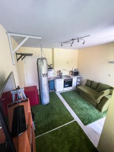 a living room with a large cylinder hanging from the ceiling at Private studio in the city center, close to subway, Medical University in Sofia