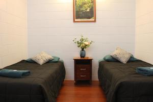 Postel nebo postele na pokoji v ubytování Cooktown Motel