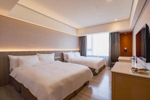 Katil atau katil-katil dalam bilik di 家美瑞品 台北 - Jiamei Hotel