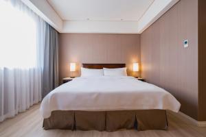 Katil atau katil-katil dalam bilik di 家美瑞品 台北 - Jiamei Hotel