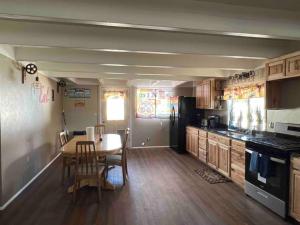 a kitchen with a table and a dining room at Get away in Old Town Chester in Chester