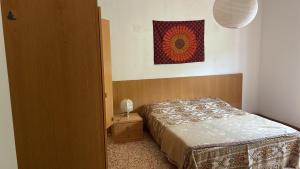 Postel nebo postele na pokoji v ubytování Laghi di Como appartamento di Licinia e Mario