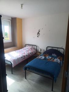 Postel nebo postele na pokoji v ubytování Appartement Volmunster