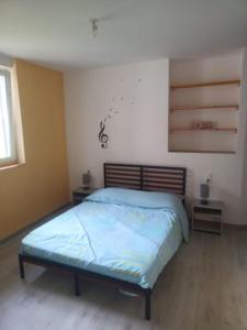 Postel nebo postele na pokoji v ubytování Appartement Volmunster
