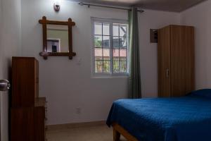 Postel nebo postele na pokoji v ubytování Villas Cozy Sloth