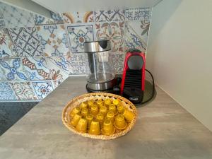 a bowl of food sitting on a counter next to a blender at "Emozione del lago" appartamento con balcone a due passi dal lago in Laglio
