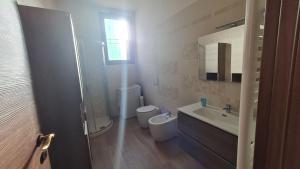 Koupelna v ubytování Dasylirion Vacanze + 16 fotografií