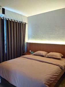 Ένα ή περισσότερα κρεβάτια σε δωμάτιο στο Villa Nuansa Alibaba Village