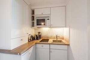 Kuchyň nebo kuchyňský kout v ubytování Timmendorfer Strand-Apartment