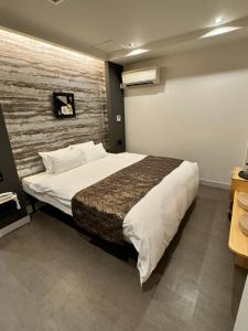 Postel nebo postele na pokoji v ubytování Hotel Be-zen shimanouchi