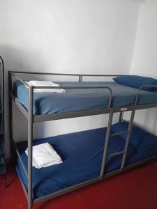 San Lorenzo Apartment tesisinde bir odada yatak veya yataklar