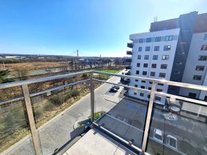 a balcony with a view of a building at VIP APARTAMENTY Lubelska in Rzeszów