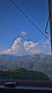 a view of a mountain range from a train window at Maison de village in Berre-les Alpes