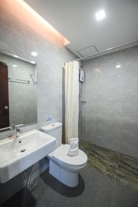 Koupelna v ubytování Figtree Hotel