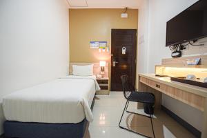 Figtree Hotel客房内的一张或多张床位