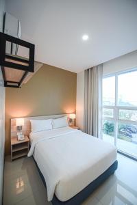 Postel nebo postele na pokoji v ubytování Figtree Hotel