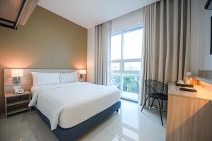 Postel nebo postele na pokoji v ubytování Figtree Hotel