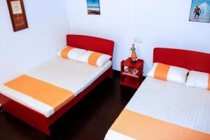 Postel nebo postele na pokoji v ubytování D'Villa Guest House
