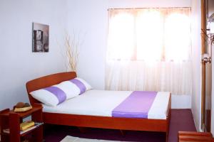 Postel nebo postele na pokoji v ubytování D'Villa Guest House