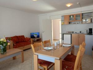 a kitchen and living room with a table and chairs at CunninghamsSilver in Sunny Beach +3 photos