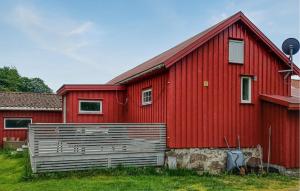 a red house with a red roof at Beautiful Apartment In Lindesnes in Gare +9 photos