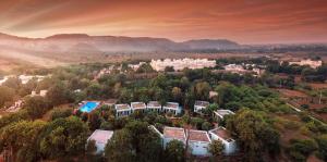an aerial view of a city with trees and buildings at The Pugmark, A Wildlife Resort in Sawāi Mādhopur +54 photos