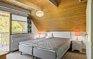 a bedroom with a bed and a wooden ceiling at Stunning Home In Højslev With Wifi in Højslev +10 photos