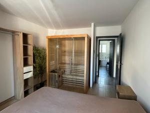 Posteľ alebo postele v izbe v ubytovaní Maison avec jacuzzi et sauna