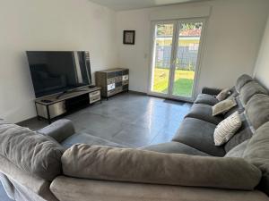 Posedenie v ubytovaní Maison avec jacuzzi et sauna