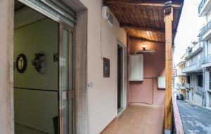 a hallway of a building with green and pink walls at 3 Bedroom Nice Home In Modica in Modica +11 photos