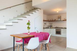 a kitchen and dining room with a table and chairs at SAN LEO, Castellabate - Mafalda in Castellabate