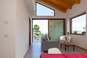 a living room with a couch and a table at SAN LEO, Castellabate - Mafalda in Castellabate