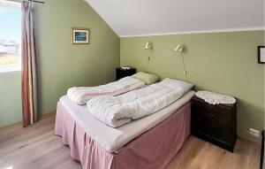 two twin beds in a room with avertisement at 3 Bedroom Gorgeous Apartment In Borhaug in Borhaug