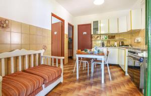 a kitchen with a table and a dining room at Casa Vacanza Scarantino 1 in Catania
