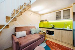 a living room with a couch and a kitchen at 6pax Full house 100m to Train street Heart of Old Quarter in Hanoi +20 photos