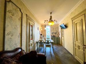 a living room with a couch and a table at Loka Chovelidze in Tbilisi City