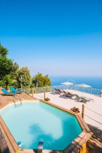 a swimming pool with a view of the ocean at Monte Brusara Relais in Ravello
