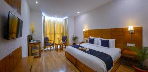 A television and/or entertainment centre at TreeHouse Chail Villas
