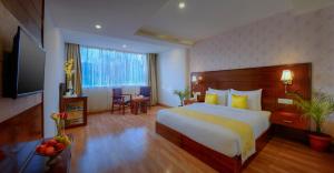 A bed or beds in a room at TreeHouse Chail Villas
