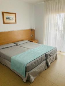 a bedroom with a large bed in a room at Hotel Vent de Mar in Puerto de Sagunto +21 photos